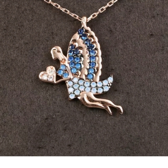 Blue winged fairy holding a white Topaz heart - Picture 2 of 4